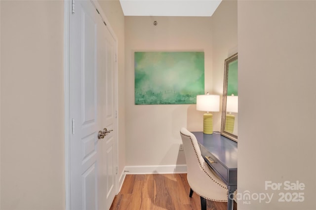 office featuring baseboards and wood finished floors