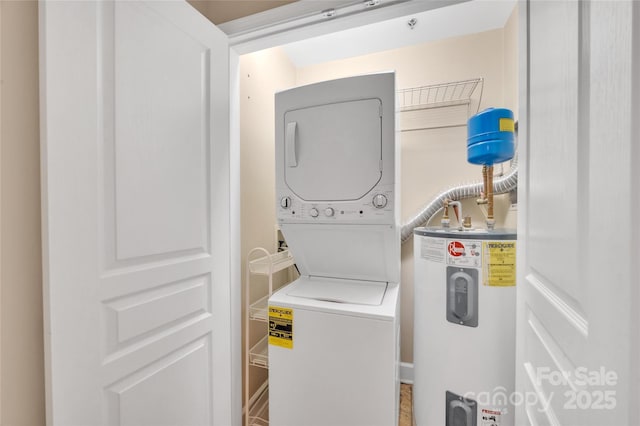 laundry area with estacked washer and dryer and electric water heater