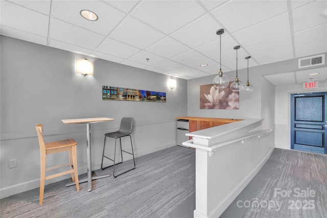 indoor dry bar with carpet, baseboards, a paneled ceiling, recessed lighting, and hanging light fixtures