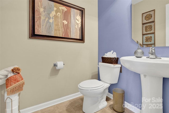 12217 Dearview Ln, Charlotte, NC 28269 - half bathroom featuring baseboards, toilet, and tile patterned flooring