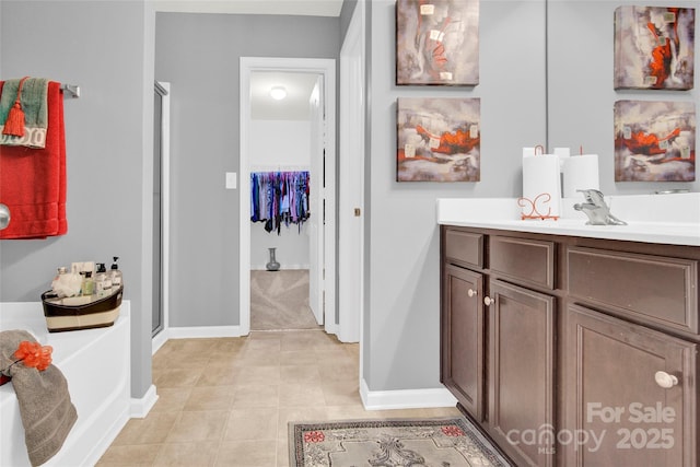 12217 Dearview Ln, Charlotte, NC 28269 - full bath with a shower stall, baseboards, vanity, and a bath