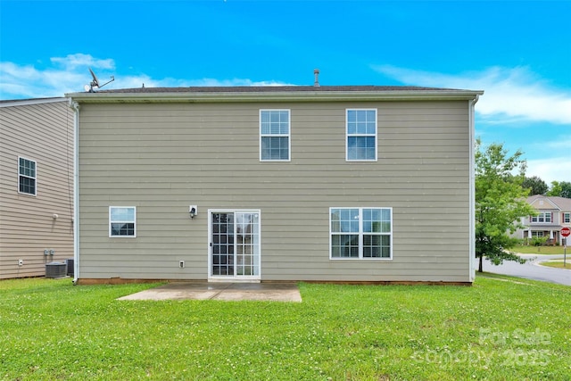 12217 Dearview Ln, Charlotte, NC 28269 - rear view of property with a patio, a lawn, and central air condition unit