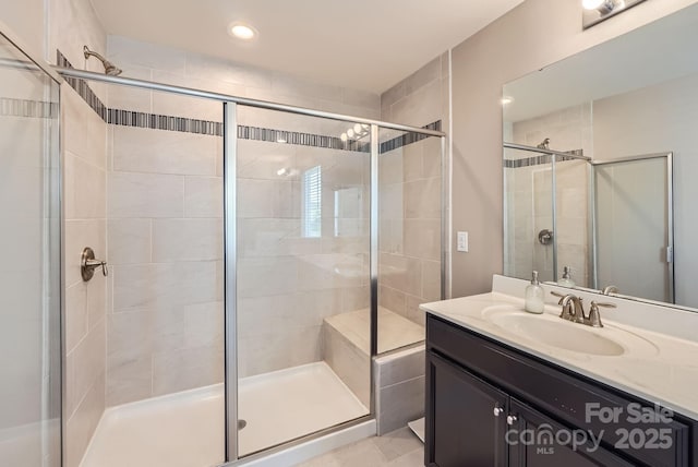 full bathroom featuring a stall shower, vanity, and recessed lighting