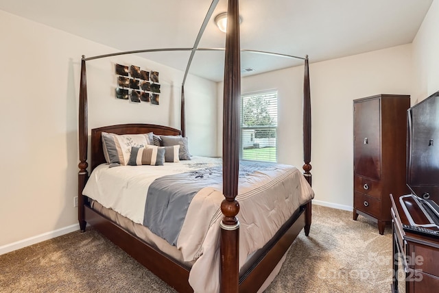 carpeted bedroom featuring baseboards