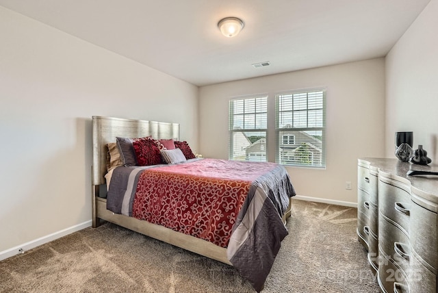 bedroom with carpet flooring and baseboards