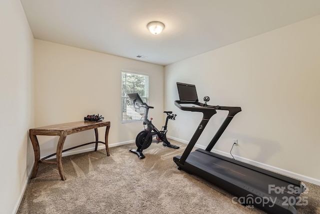 workout area with carpet floors and baseboards