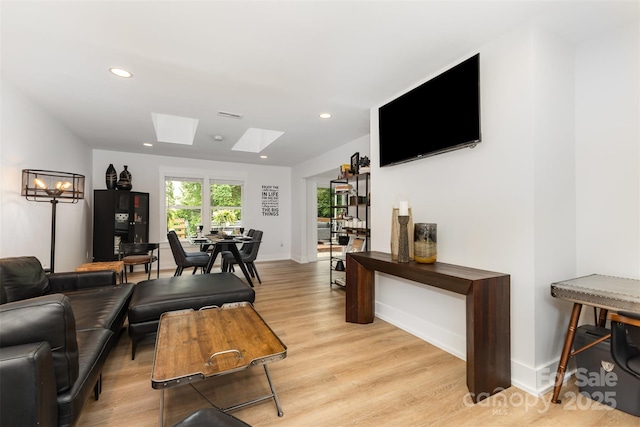 6824 Cortez Trl, Charlotte, NC 28227 - living area with a skylight, light wood-type flooring, recessed lighting, and baseboards