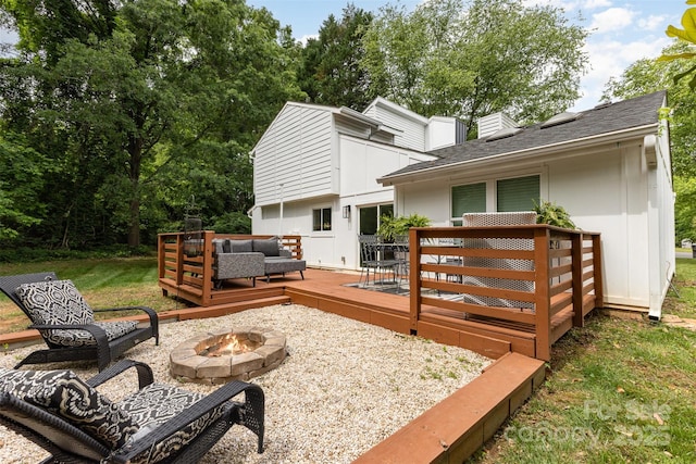 6824 Cortez Trl, Charlotte, NC 28227 - back of property featuring an outdoor living space with a fire pit, a wooden deck, and roof with shingles