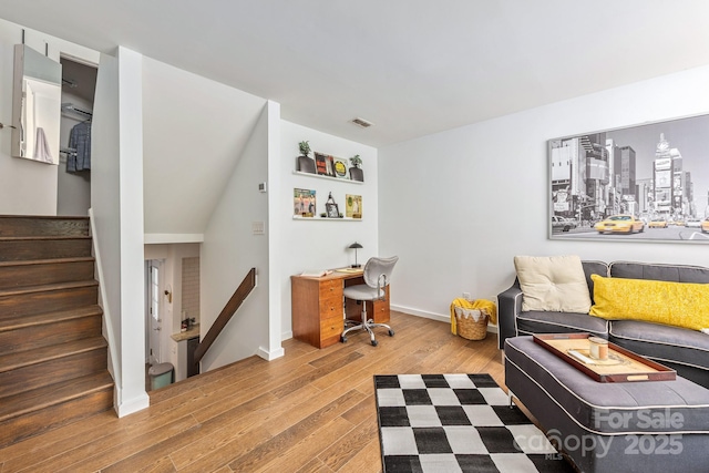 office space featuring wood finished floors and baseboards