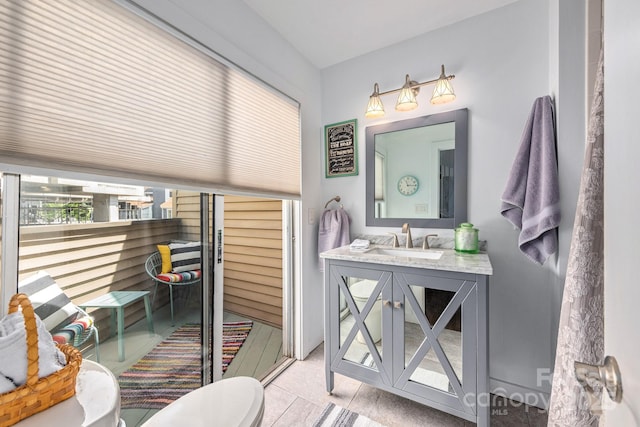 bathroom with tile patterned floors and vanity