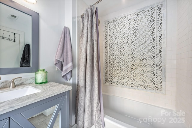 bathroom with shower / bath combo with shower curtain and vanity