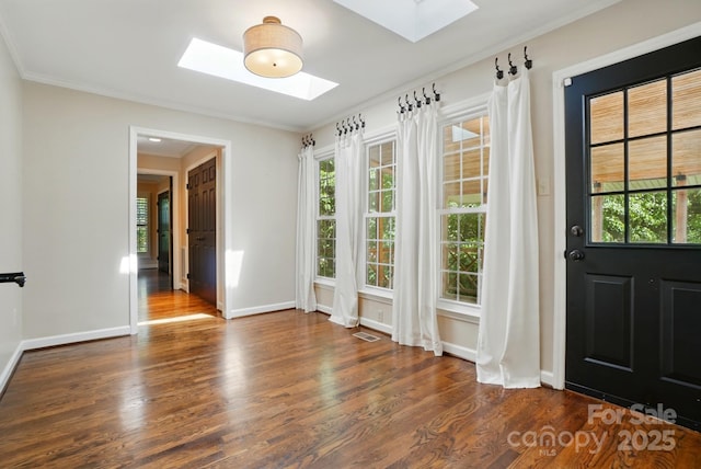 1295 Patterson St, China Grove, NC 28023 - entrance foyer with a skylight, wood finished floors, baseboards, plenty of natural light, and ornamental molding