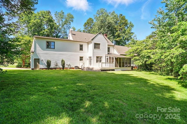1295 Patterson St, China Grove, NC 28023 - back of house with a sunroom, a chimney, a lawn, and a shingled roof