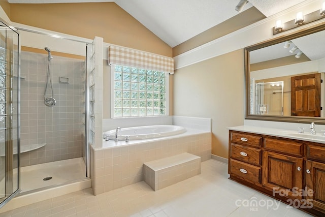 1295 Patterson St, China Grove, NC 28023 - bathroom featuring tile patterned flooring, a stall shower, a bath, vanity, and lofted ceiling