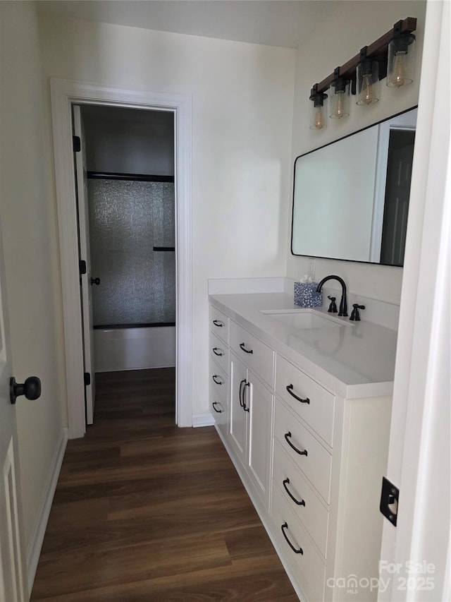 1111 Unionville Church Rd, Monroe, NC 28110 - full bath with wood finished floors, vanity, and baseboards