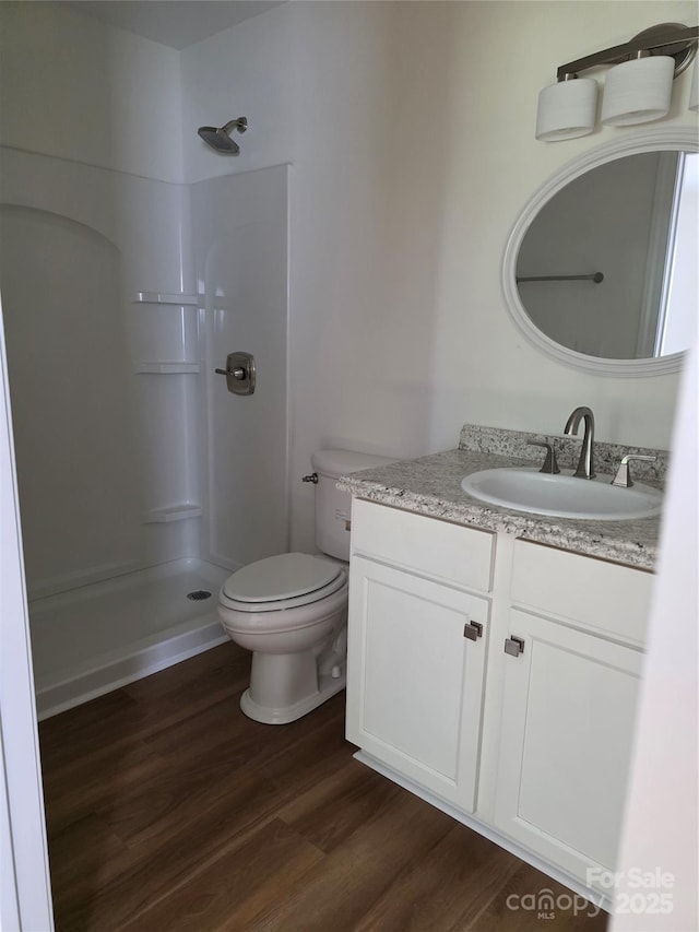 1111 Unionville Church Rd, Monroe, NC 28110 - full bathroom with a shower, wood finished floors, vanity, and toilet