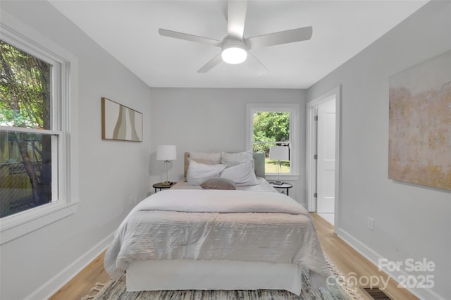 1829 Jennings St, Charlotte, NC 28216 - bedroom with light wood-style floors, baseboards, and ceiling fan