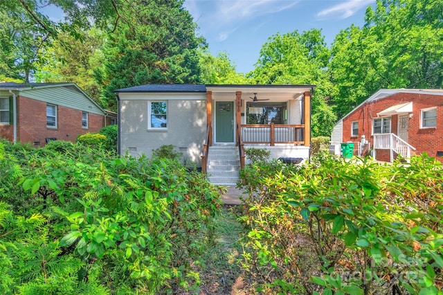 1829 Jennings St, Charlotte, NC 28216 - bungalow with covered porch, brick siding, stairway, and a ceiling fan