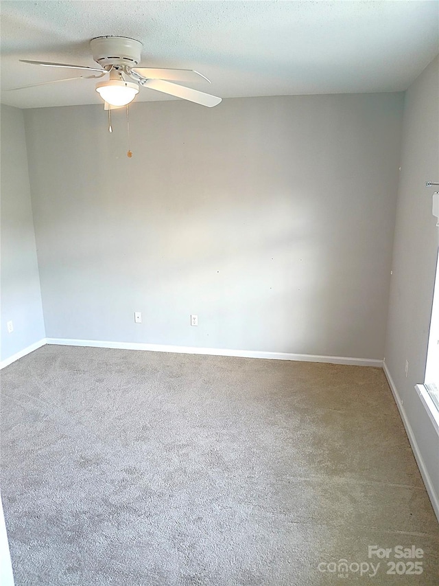 12304 Sandringham Pl, Charlotte, NC 28262 - unfurnished room with carpet, ceiling fan, and baseboards