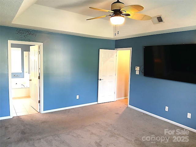 12304 Sandringham Pl, Charlotte, NC 28262 - unfurnished bedroom with carpet, baseboards, ensuite bathroom, and tile patterned flooring