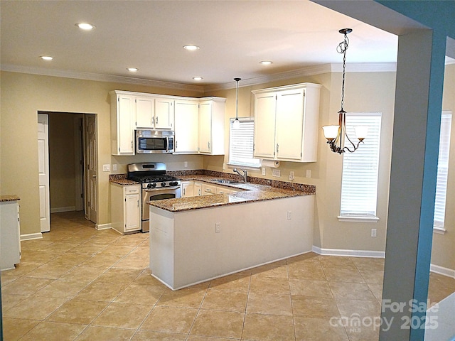 12304 Sandringham Pl, Charlotte, NC 28262 - kitchen featuring stainless steel appliances, a sink, ornamental molding, a peninsula, and healthy amount of natural light