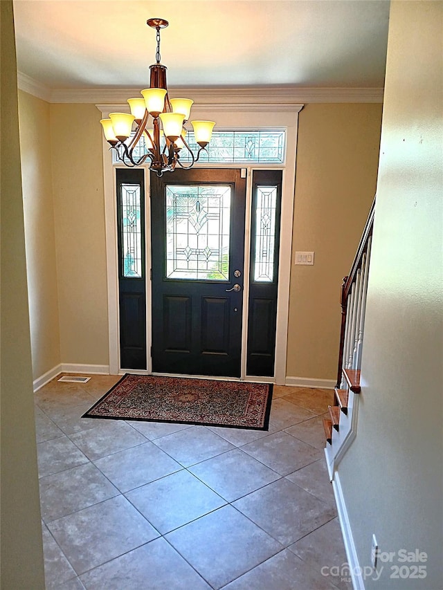 12304 Sandringham Pl, Charlotte, NC 28262 - foyer entrance featuring a chandelier, baseboards, ornamental molding, stairs, and tile patterned floors