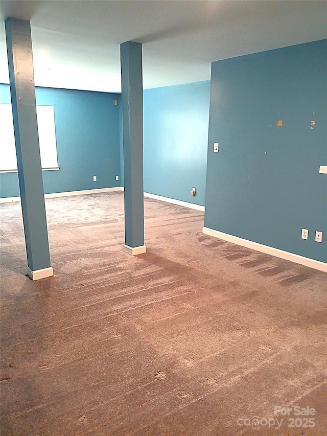 12304 Sandringham Pl, Charlotte, NC 28262 - below grade area featuring baseboards and carpet