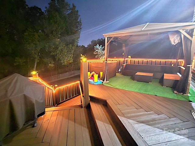 12304 Sandringham Pl, Charlotte, NC 28262 - deck at twilight featuring a grill