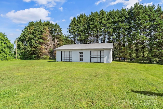 35 Telephone Exchange Rd, Hickory, NC 28601 - view of grassy yard featuring an outdoor structure, a detached garage, and a pole building