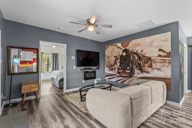 35 Telephone Exchange Rd, Hickory, NC 28601 - living area with wood finished floors, a ceiling fan, and baseboards