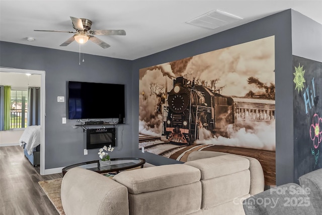 35 Telephone Exchange Rd, Hickory, NC 28601 - living area with wood finished floors, a ceiling fan, and baseboards