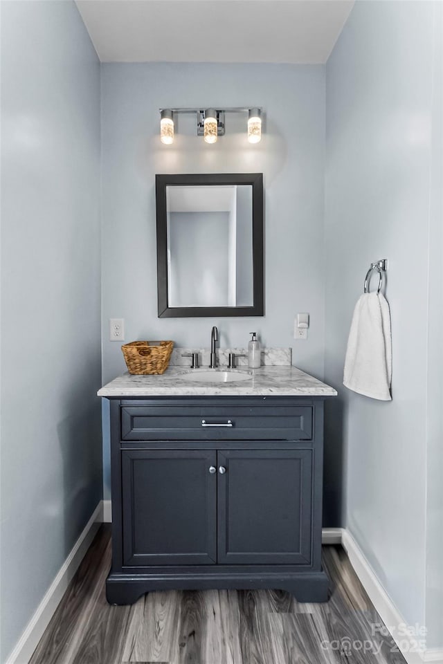 35 Telephone Exchange Rd, Hickory, NC 28601 - bathroom with baseboards, vanity, and wood finished floors