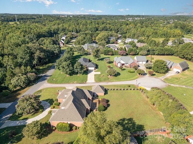 aerial view of property's location with a forest