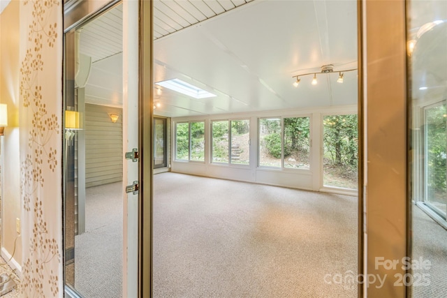 30 Robin Ln, Asheville, NC 28806 - unfurnished sunroom with a skylight, plenty of natural light, carpet, lofted ceiling, and french doors