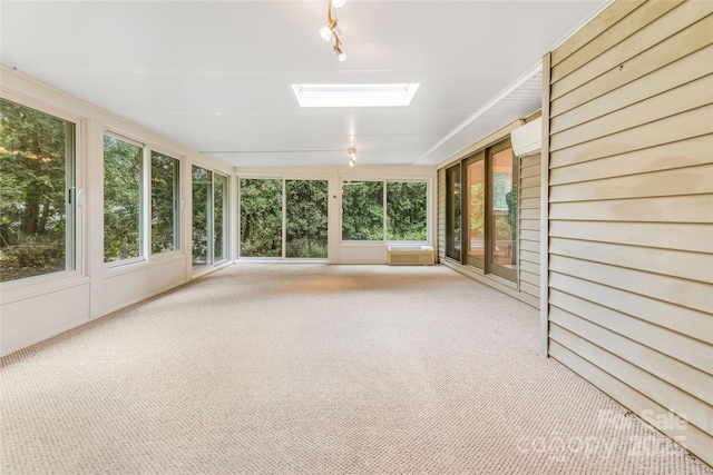 30 Robin Ln, Asheville, NC 28806 - unfurnished sunroom featuring a skylight, carpet, and rail lighting