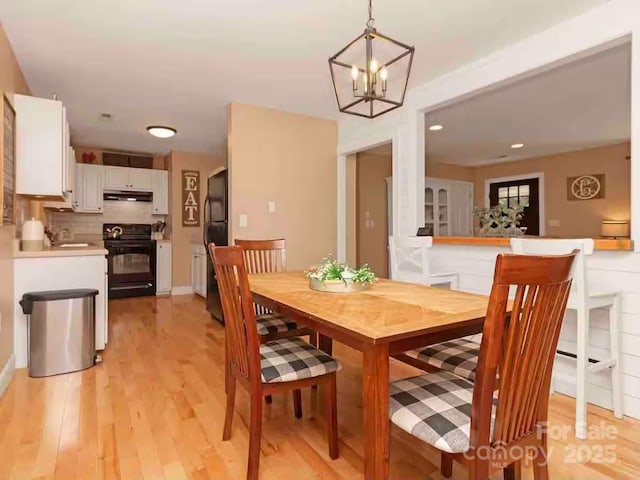 150 Deerwoode Ln, Brevard, NC 28712 - dining area featuring light wood-style flooring, a chandelier, and recessed lighting