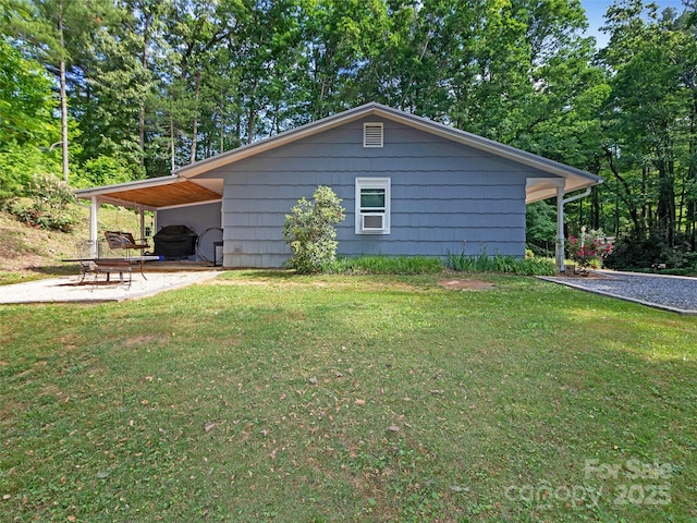150 Deerwoode Ln, Brevard, NC 28712 - view of side of home featuring a lawn and a carport