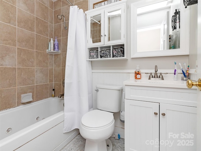 150 Deerwoode Ln, Brevard, NC 28712 - bathroom with vanity, a combined bath / shower with jetted tub, toilet, and wainscoting