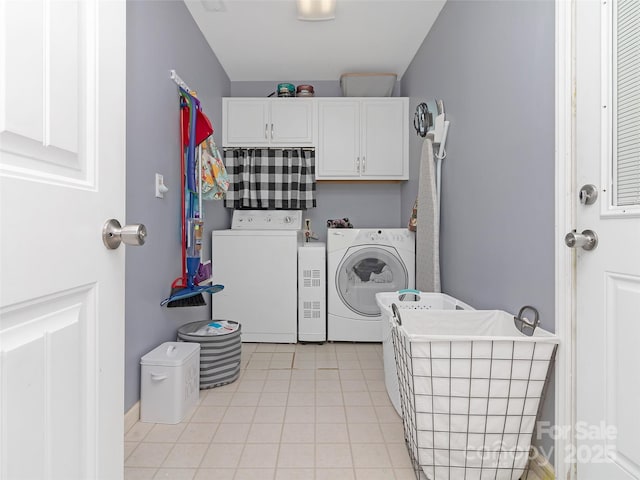 150 Deerwoode Ln, Brevard, NC 28712 - laundry room with cabinet space, light tile patterned floors, and washing machine and clothes dryer
