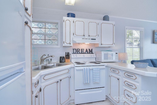 108 Brit Ln, New London, NC 28127 - kitchen with white appliances, under cabinet range hood, a sink, a peninsula, and white cabinetry
