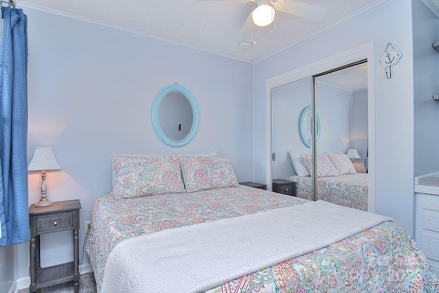 108 Brit Ln, New London, NC 28127 - bedroom featuring crown molding, a closet, a textured ceiling, a ceiling fan, and baseboards