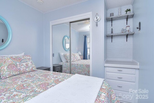 108 Brit Ln, New London, NC 28127 - bedroom featuring a textured ceiling, ornamental molding, and a closet