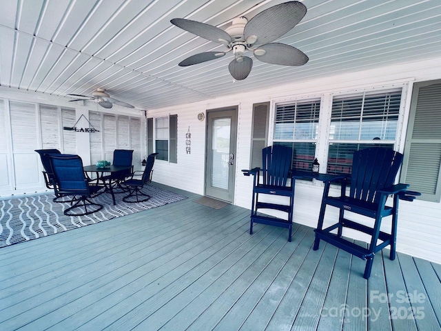108 Brit Ln, New London, NC 28127 - wooden deck featuring a ceiling fan and outdoor dining area
