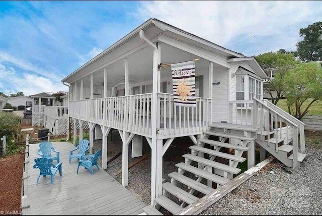108 Brit Ln, New London, NC 28127 - view of property exterior featuring stairs, a deck, and a sunroom
