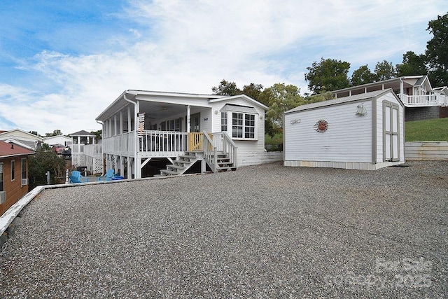 108 Brit Ln, New London, NC 28127 - view of front of property with stairway, an outdoor structure, ceiling fan, and a storage shed
