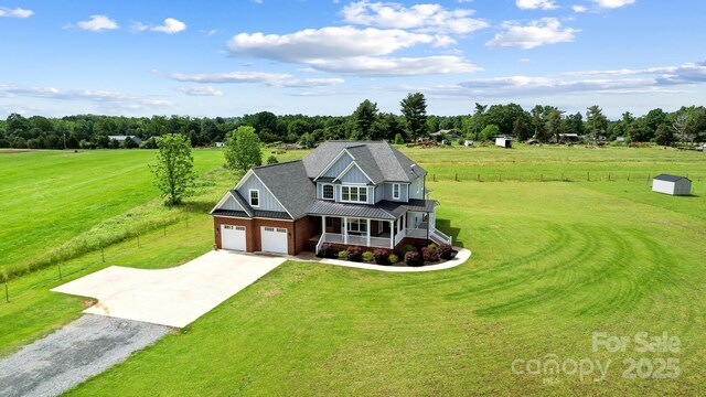 3707 Seagrave Farm Rd, Concord, NC 28025 - view of front of home with a porch, concrete driveway, a front yard, metal roof, and board and batten siding