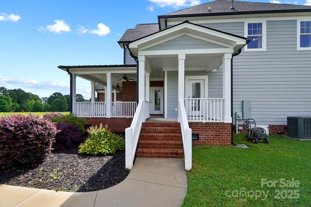 3707 Seagrave Farm Rd, Concord, NC 28025 - view of front facade featuring a porch, ceiling fan, cooling unit, and a front yard
