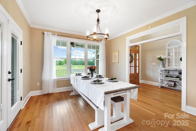 3707 Seagrave Farm Rd, Concord, NC 28025 - dining room featuring a chandelier, light wood finished floors, french doors, ornamental molding, and baseboards