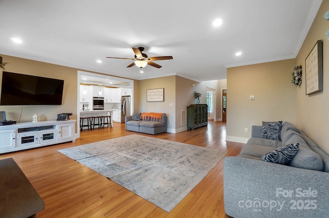 3707 Seagrave Farm Rd, Concord, NC 28025 - living room featuring ceiling fan, ornamental molding, light wood-type flooring, recessed lighting, and baseboards