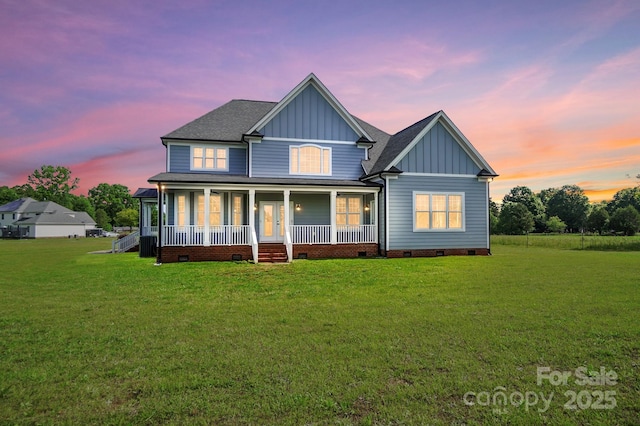 3707 Seagrave Farm Rd, Concord, NC 28025 - rear view of house featuring board and batten siding, crawl space, covered porch, and a lawn